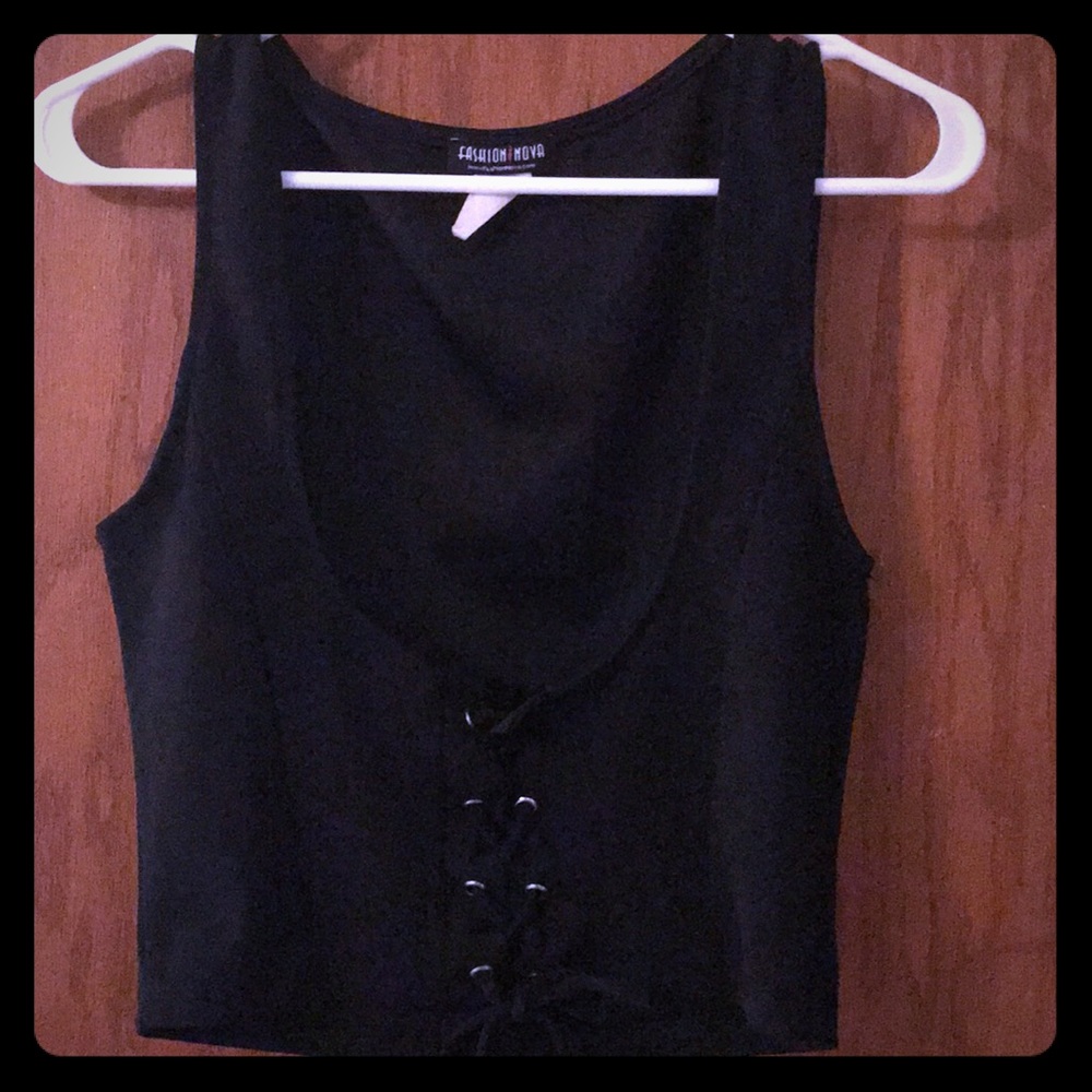 Corset-like cropped vest.